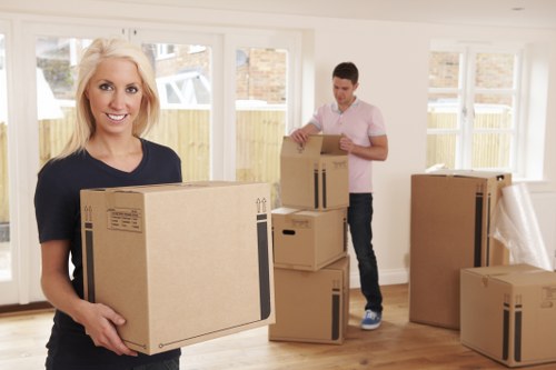 Office boxes, labels, and furniture organised for a local business move