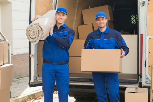 Furniture removals team handling items in a Marylebone residential street