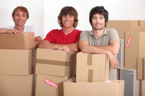 Moving crew handling desks and files during a central London commercial relocation