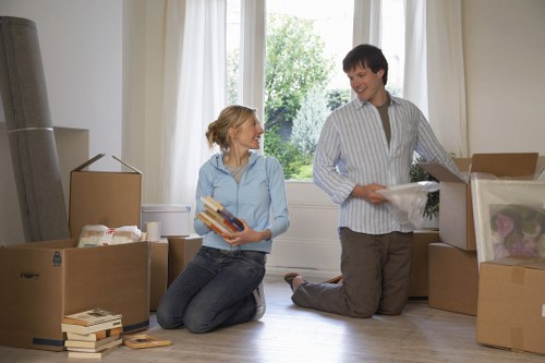 Professional removal team managing stairs and boxes in a Marylebone flat