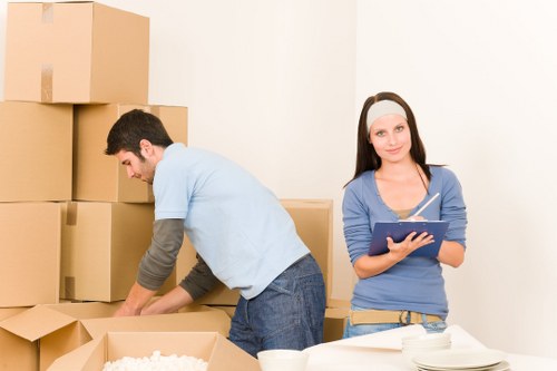Unpacking assistance in a Marylebone flat with boxes arranged by room