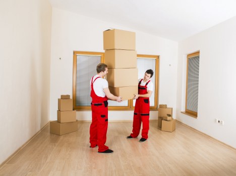 Packed moving boxes and household items prepared for urgent relocation